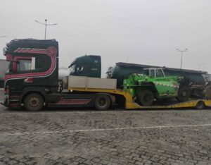 truck transporting tractor